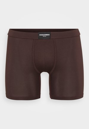 Boxer in cotone marrone realizzati in tessuto morbido, con design aderente e vita nera con etichetta "DSQUARED2 MILANO".