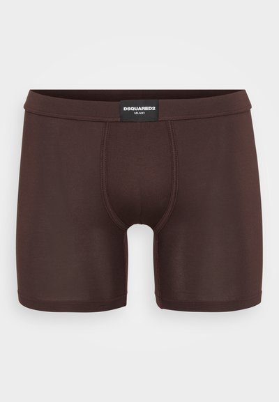 Boxer in cotone marrone realizzati in tessuto morbido, con design aderente e vita nera con etichetta "DSQUARED2 MILANO".