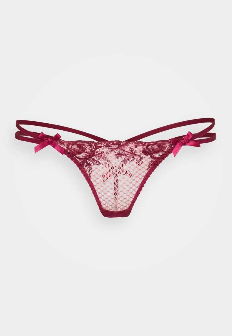 String en dentelle avec un tissu en maille bordeaux, présentant des motifs floraux intricats et deux délicats nœuds en satin sur les côtés pour une touche de détail.