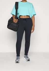 Under Armour Jogginghose - black