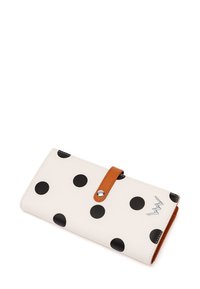 White wallet with large black polka dots. Features a brown leather strap and silver hardware accent. Smooth texture with a sleek design.