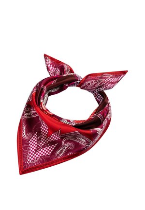 Square silk scarf folded into a triangle and tied with a knot, featuring red, burgundy, white paisley and checkered patterns.