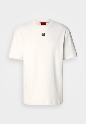 White cotton t-shirt with a crew neck, short sleeves, and a small black square logo with "HUGO" on the chest. Plain design, soft texture.