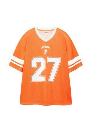 Oranje sportshirt met korte mouwen, witte V-halskraag, witte strepen op de mouwen, nummer 27 en een kleine leeuw met de tekst "STWD" erboven.