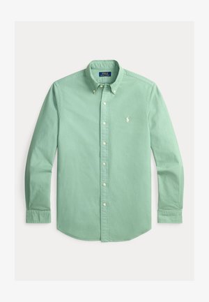 Chemise vert menthe à manches longues avec boutons, col boutonné et logo blanc brodé sur la poitrine gauche.