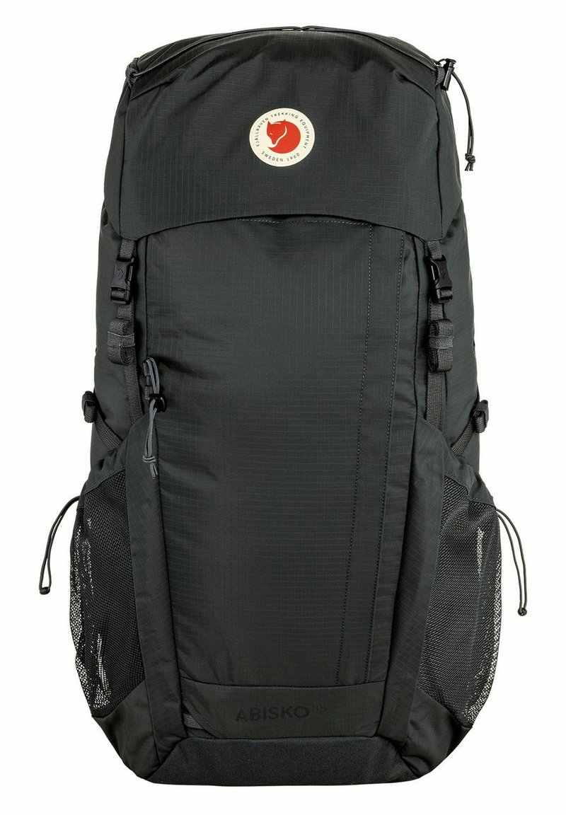 Black nylon backpack with a large main compartment, adjustable straps, mesh side pockets, and a circular logo on the front panel.