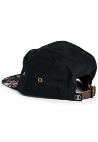 Black cotton cap with a floral-patterned brim, featuring ventilation grommets and an adjustable leather strap at the back.