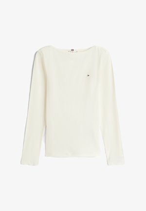 Langærmet, ribbet, off-white top. Har en rund neckline og lille logo på brystet. Blødt stof med minimalistisk design.