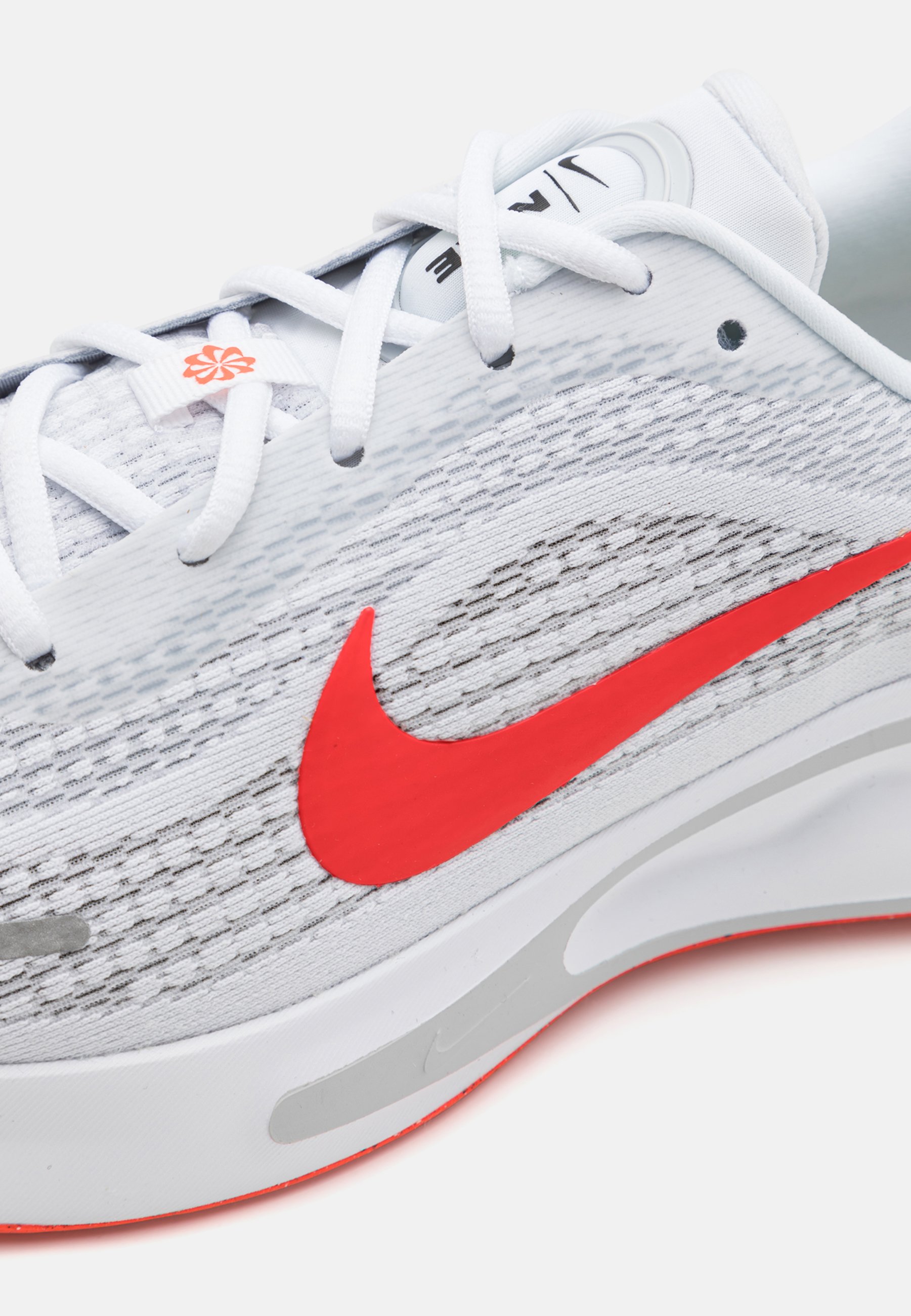 grey and red nike trainers