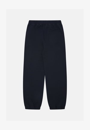 Granatowe dresy z miękkiego materiału, z boczną kieszenią, elastycznym pasem i zwężanymi nogawkami z mankietami przy kostkach.