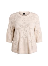 Pull en tricot beige clair avec un motif floral, col rond et manches trois quarts avec des bords côtelés.