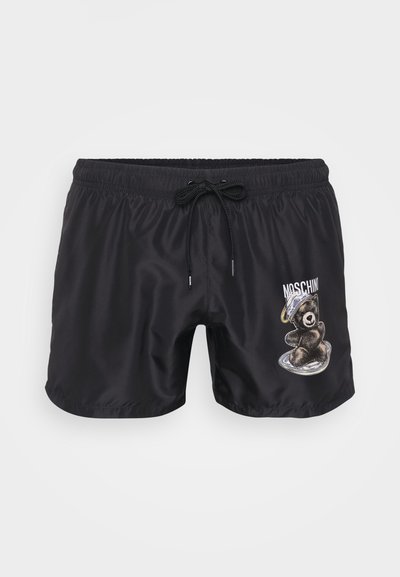 Musta uima-asu, joka on valmistettu sileästä kankaasta, ja jossa on brodeerattu karhukuva ja kiristysnyöri, jossa on kontrastiväriset yksityiskohdat.