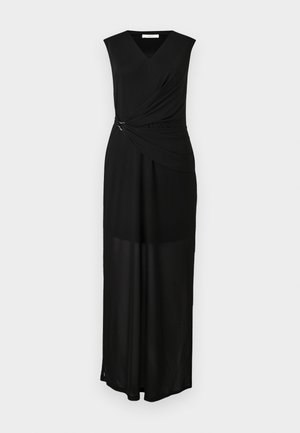 Sleeveless black maxi dress with V-neck, gathered fabric detail cinched at waist with small metal ring, and semi-sheer lower skirt panel.