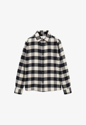 Koszula z długim rękawem zapinana na guziki, z dużym czarno-białym wzorem w kratę i klasycznym kołnierzem.