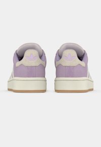 Purple sneakers with a textured light gray heel and white lateral detailing. Features a beige sole and embossed logo on the heel.