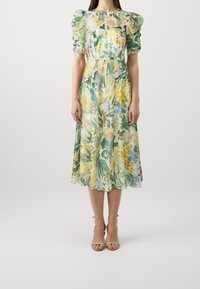 Blumenkleid in Midi-Länge aus leichtem Material mit grünen, gelben und blauen Mustern, Puffärmeln und taillierter Passform.