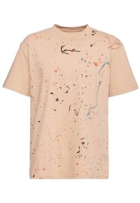Svetle béžové tričko s potiskem ve stylu rozlitých barev v korálové, tyrkysové a hnědé. Volný střih s kulatým výstřihem a krátkými rukávy.