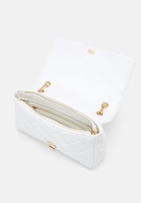 Quilted white leather handbag with a gold hardware clasp and interior zip pocket. Features a smooth lining and double chain detail.