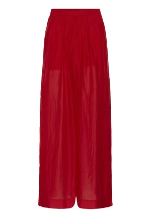 Dlhé červené široké nohavice s elastickým pásom a šnúrkou, vyrobené z ľahkej, mierne lesklej tkaniny.