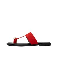 Red suede flat flip-flop sandal with a wide strap, black rubber sole, and a golden embellishment at the toe post for added detail.
