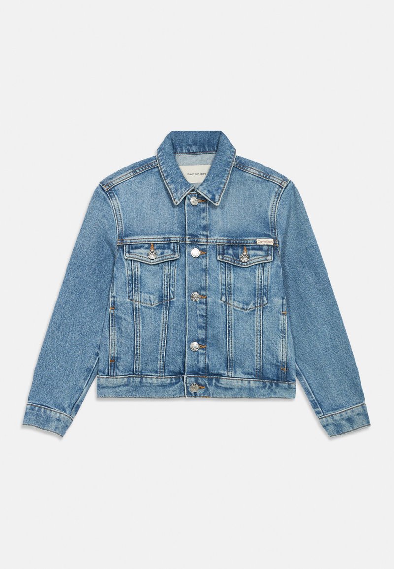 Klassikaline helesinine teksajakk. Omab kahte rinnataskut, hõbedast nuppe ja struktureeritud kraed. Kanga kulunud tekstuur.