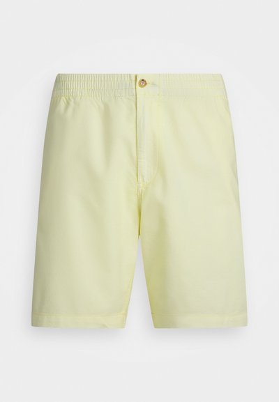 Shorts de bain jaune clair avec une taille élastique, une fermeture à bouton à l'avant et une texture de tissu lisse. Design simple sans motifs.