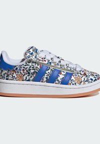 White sneakers with floral print in blue, orange, and green. Features blue side stripes and a textured white rubber sole.