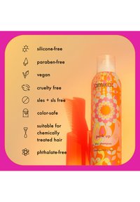 Bouteille de shampoing sec avec un design floral éclatant en orange et rose. Dispose d'une pompe blanche sur le dessus, accompagnée d'un peigne rouge.