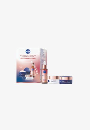NIVEA Ultimate Lift Solution, featuring a white and blue box, contains three containers: a dropper bottle, a cream jar, and a nighttime cream.