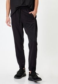 Koton SPORT - Pantalones deportivos - black