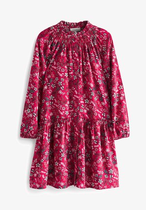 Rød langærmet kjole med hvide og sorte blomsterprint, sammenrynket halsudskæring, knapper foran og elastiske manchetter.