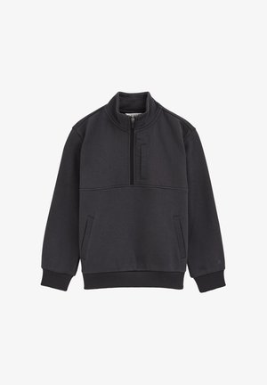 Schwarzer Pullover mit hohem Kragen, durchgehendem Reißverschluss, Seitentaschen, gerippten Bündchen und strukturierten Stoffpaneelen.