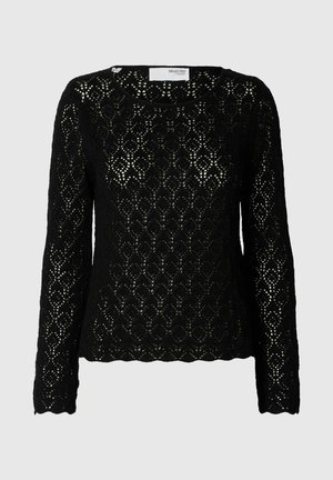 Top en dentelle noire à manches longues avec un motif en losange, col rond et coupe légèrement ample. Le tissu texturé ajoute un intérêt visuel.