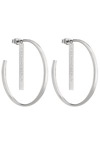 Boucles d'oreilles en argent en forme d'anneau, dotées d'un design lisse et arrondi, ornées d'une étiquette verticale gravée "LIEBESKIND."