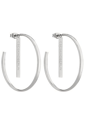 Boucles d'oreilles en argent en forme d'anneau, dotées d'un design lisse et arrondi, ornées d'une étiquette verticale gravée "LIEBESKIND."