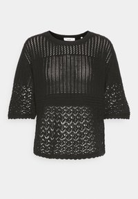 Svart stickad topp med lös passform, med korta ärmar och ett öppet mönster. Broderade kanter och texturerade tygdetaljer.