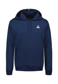 Felpa con cappuccio blu navy in cotone, con tasca a marsupio frontale e cappuccio con coulisse. Include un logo bianco sul petto e un accento tricolore.