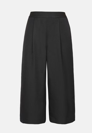 Pantalons larges noirs avec une taille plate, dotés de plis à l'avant, d'une texture lisse et d'un design à la longueur de la cheville. Sans poches ni motifs.