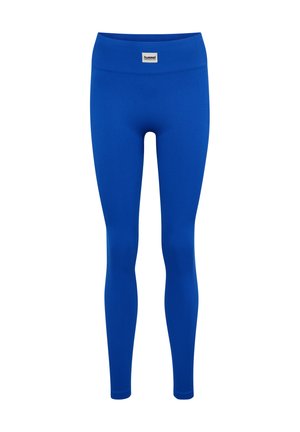 Blauwe, geribbelde legging in volledige lengte met een hoge tailleband en een klein wit merklabel in het midden aan de voorkant.