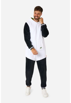 White and black fleece onesie with a hood, featuring a front pocket and green accent. Ribbed cuffs and a zip closure at the front.