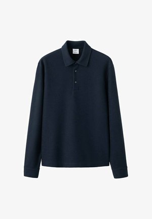 Temno modra polo majica z dolgimi rokavi z rebrasto teksturo, trirazpirno zadrgo, ravnim ovratnikom in ravnim robom. Izdelana iz mehke in trpežne tkanine.