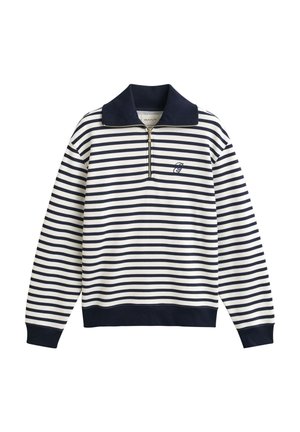 Pull-over à manches longues à rayures horizontales bleu marine et blanches avec demi-fermeture éclair, col, poignets et taille foncés, et petit logo brodé sur la poitrine.