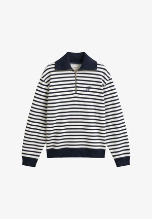 Pull-over à manches longues à rayures horizontales bleu marine et blanches avec demi-fermeture éclair, col, poignets et taille foncés, et petit logo brodé sur la poitrine.