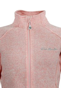 Veste zippée rose clair en tissu texturé. Présente un col montant, des coutures discrètes et un détail de logo sur le devant.