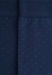 Tessuto a maglia blu navy con un motivo testurizzato, caratterizzato da piccoli punti bianchi, uniformemente distribuiti. Texture liscia ed elastica.