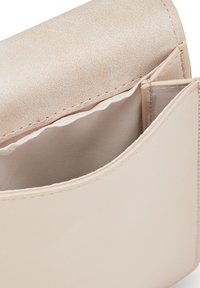 Beige faux leather clutch with a sleek, smooth surface, featuring a spacious interior pocket and contrasting light fabric lining.