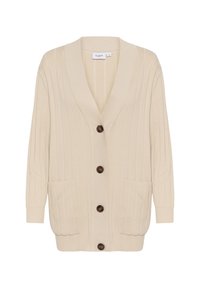 Bežinė raštuota kardiganas su giliu V formos kaklu, rudos spalvos mygtukais, dviem priekinėmis kišenėmis ir laisvu kirpimu. Minkšta tekstūra ir ilgos rankovės.