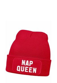 Red knit beanie with a cuff, featuring the white text "NAP QUEEN" on a rectangular patch. Soft fabric with vertical ribbing.