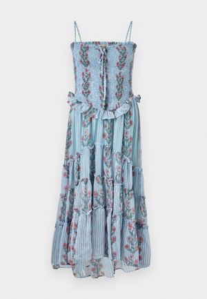 Lille lillelillede kleit sinise triibulise kangaga, rongsatud puusaga ja volangiga äärega. Omab õhukesi rihmu ja lillemotiive roosa ja rohelise värviga.