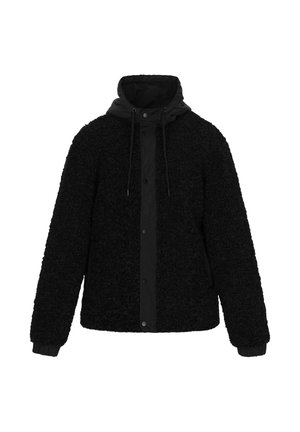 Giacca in pile nera con esterno testurizzato, polsini elastici e cappuccio staccabile con cordini. Chiusura a pressione con bottoni sul davanti.